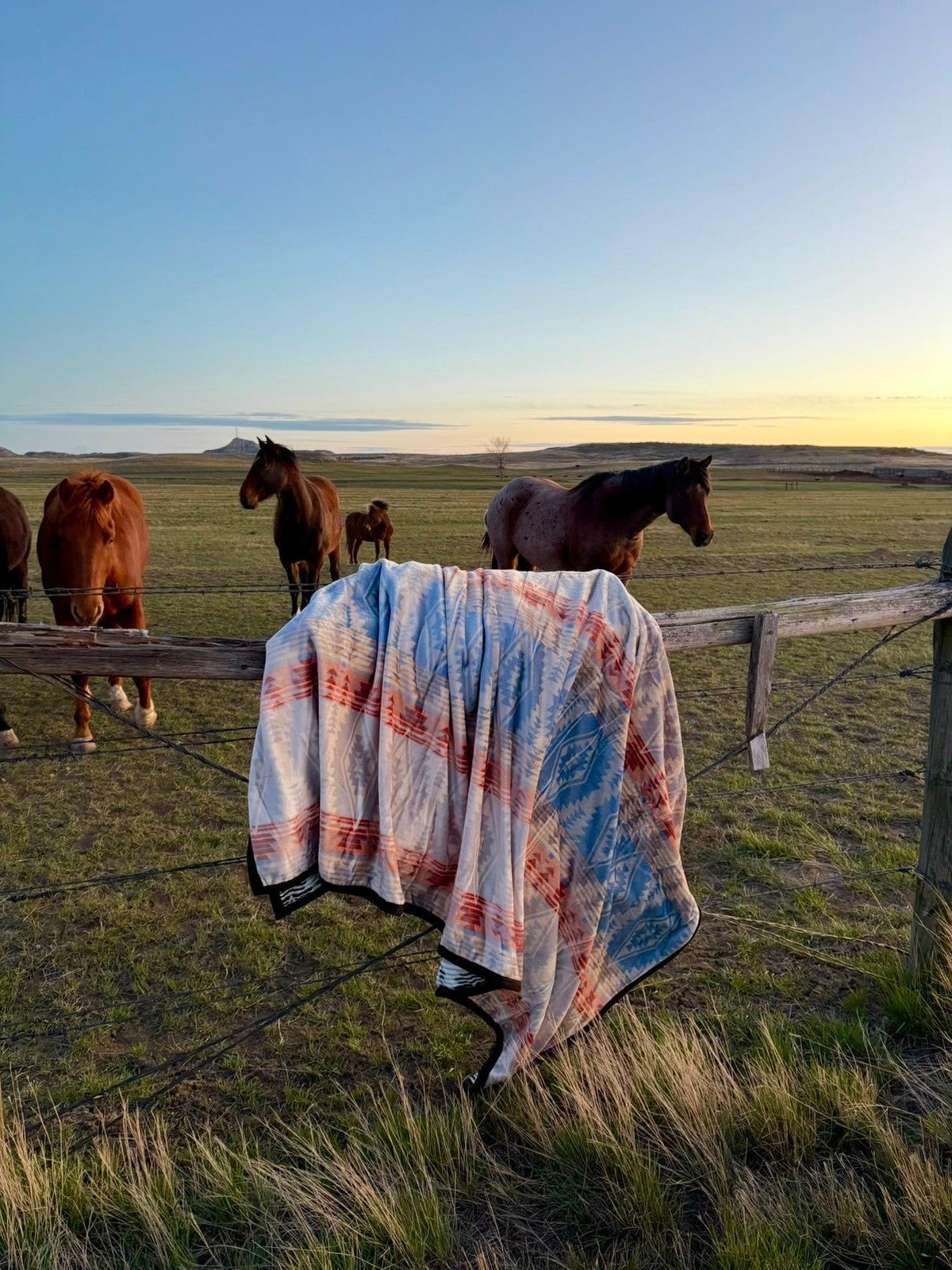 GS Blankets Zigzag Queen blanket on a fence